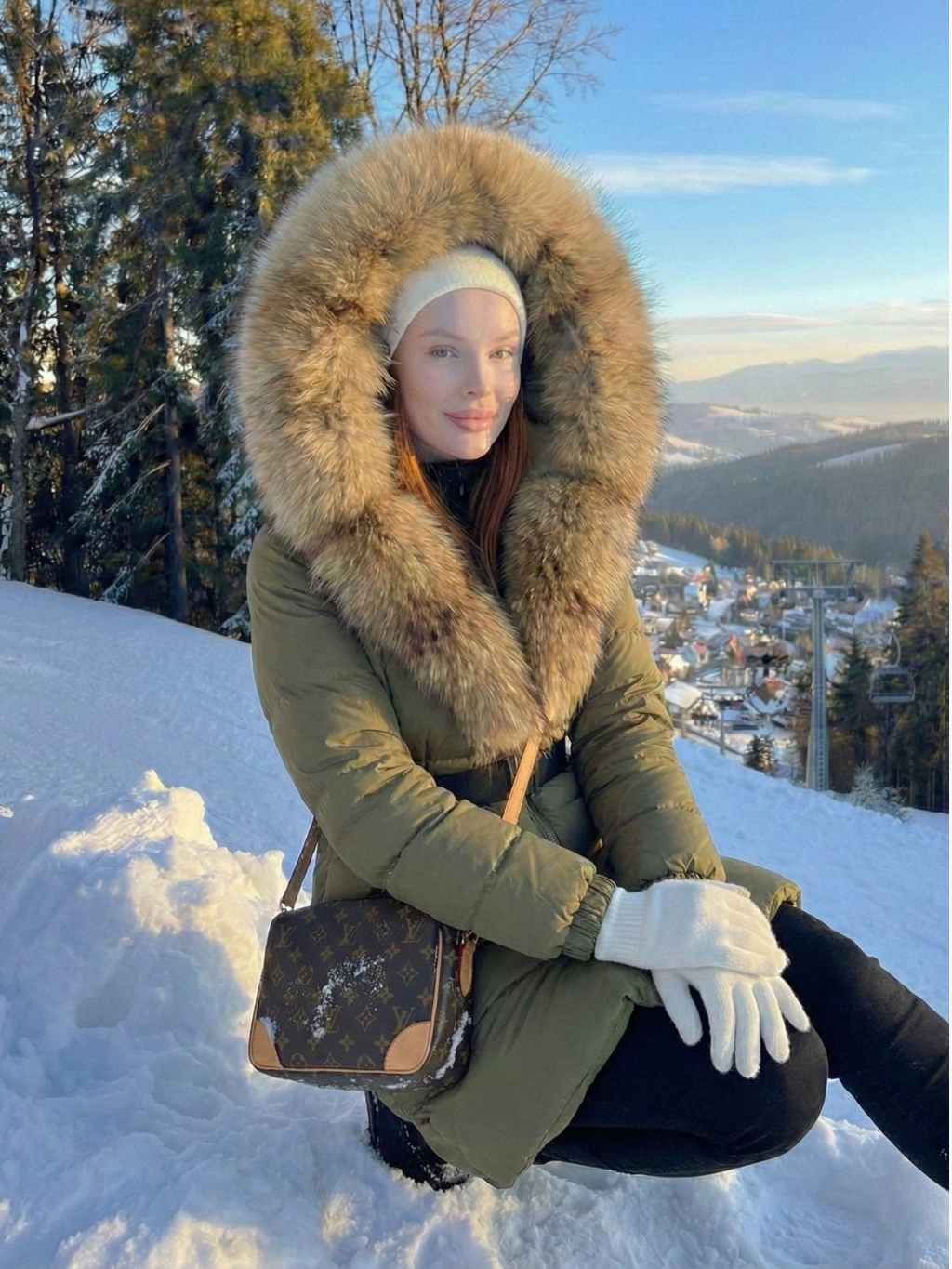 Jane | Long belted puffer jacket with faux fur hood